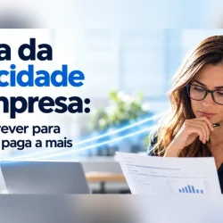Gestora a analisar a fatura da eletricidade da empresa em papel à secretária, ao lado de um portátil