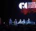 Painel de oradores no palco do Game Changers Forum 2026, na MEO Arena, com o logótipo do fórum no ecrã gigante
